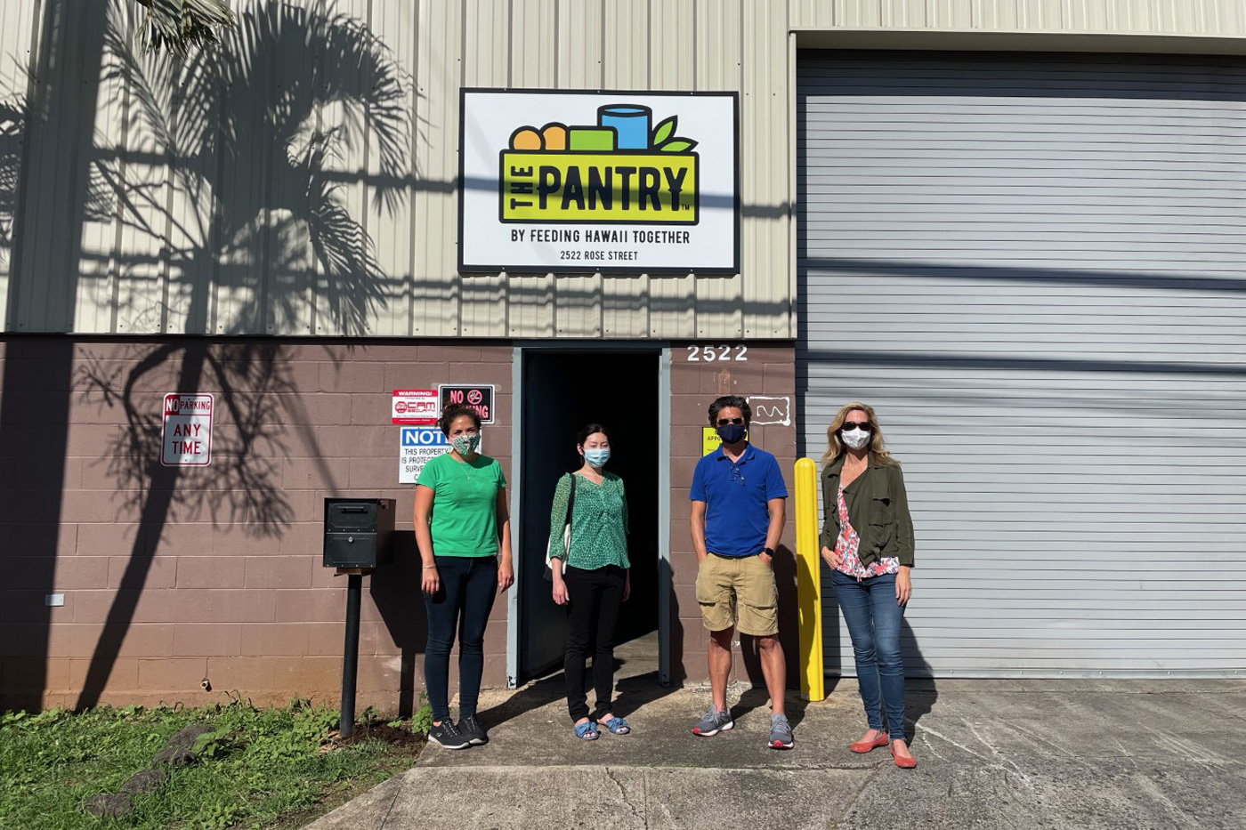 Paige Rodgers, Jeffrey Wat, and Aiko Shimizu check out The Pantry by Feeding Hawaii Together’s warehouse with Executive Director, Jennine Sullivan.